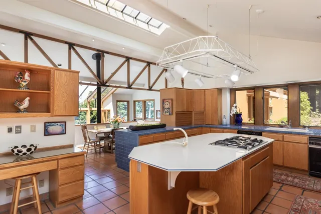 a kitchen with a table chairs and a stove