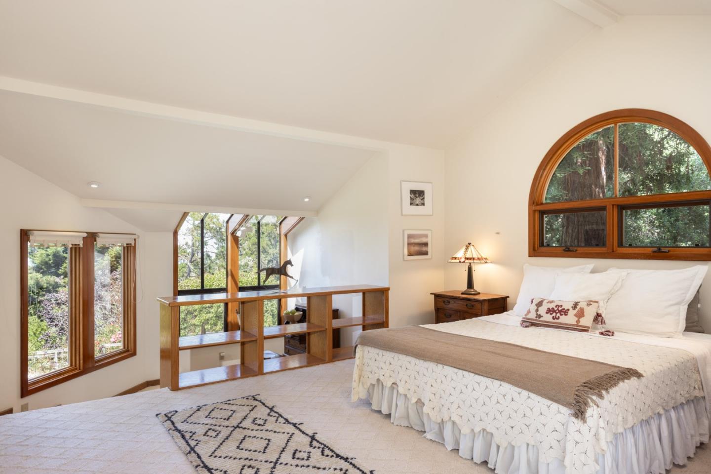 540 Aguajito Road Carmel, CA 93923 - Photo 25 of 35 a bedroom with a large bed and a window