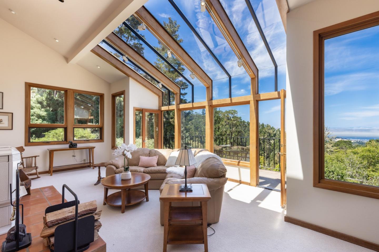 540 Aguajito Road Carmel, CA 93923 - Photo 10 of 35 a living room with furniture and a large window
