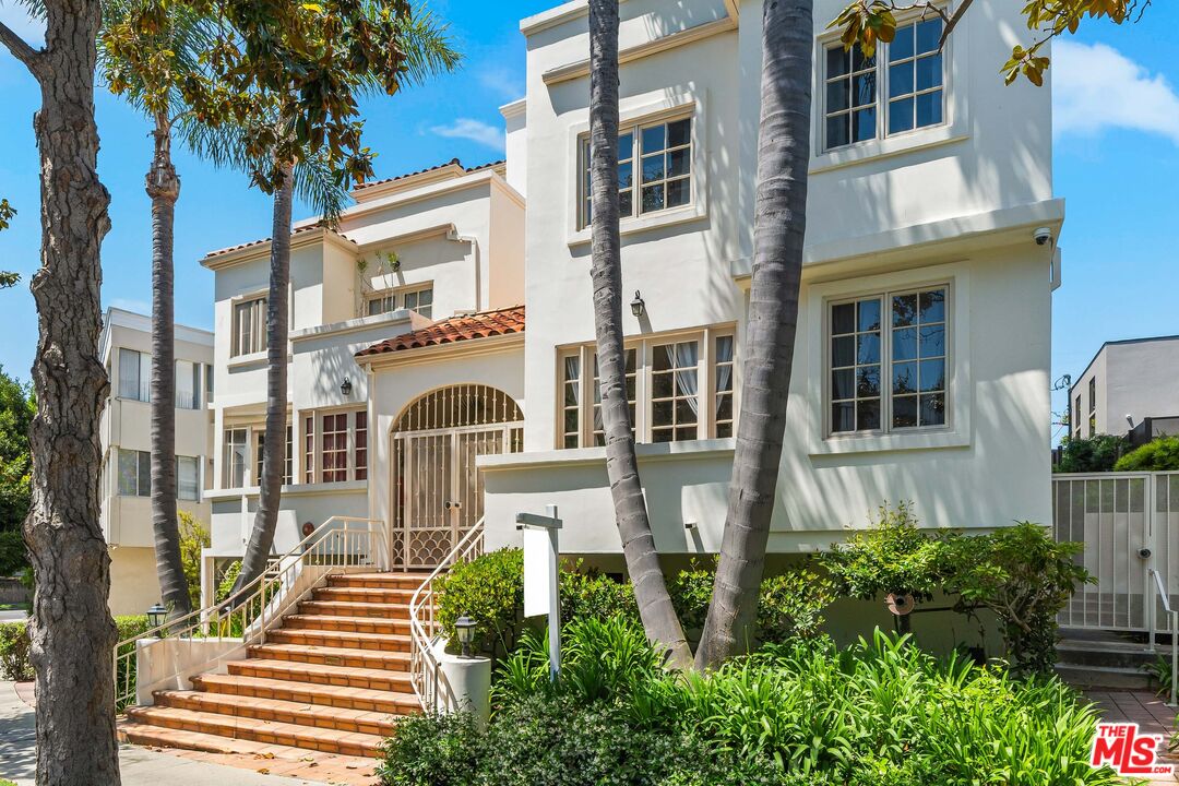 1663 Malcolm Avenue, Unit 103 Los Angeles, CA 90024 - Photo 2 of 45 a front view of a house with a garden
