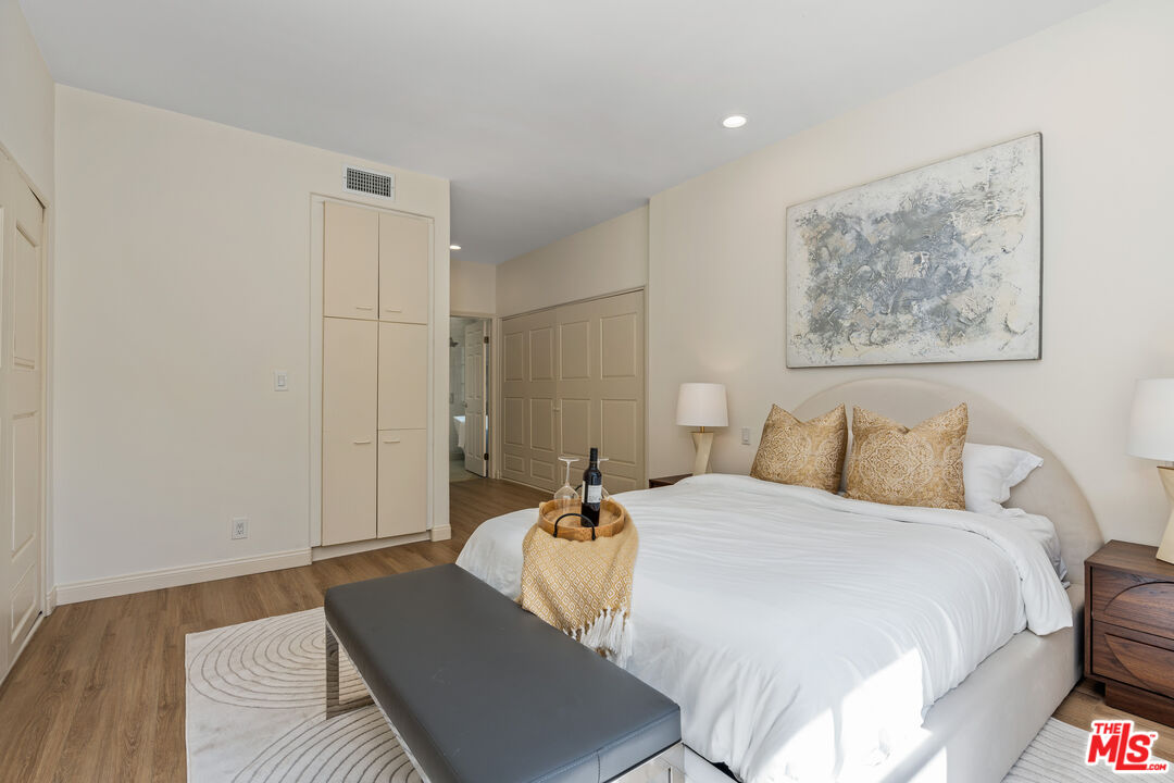 1663 Malcolm Avenue, Unit 103 Los Angeles, CA 90024 - Photo 22 of 45 a bedroom with a bed and a couch