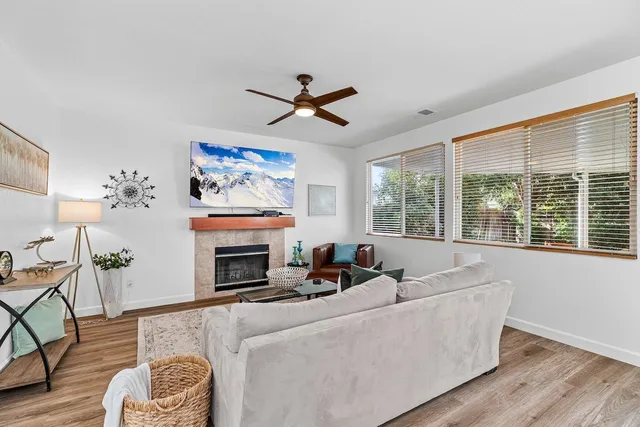 a kitchen with stainless steel appliances white cabinets and a stove top oven