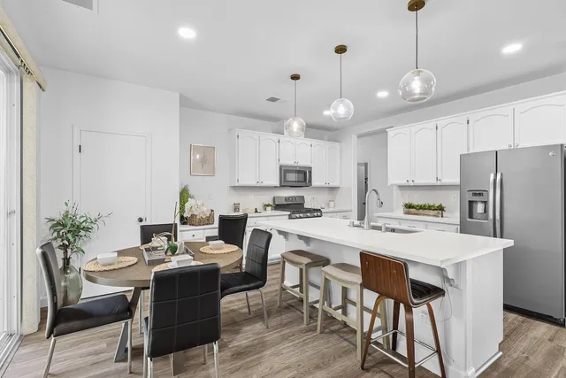 a view of entryway with wooden floor and stairs