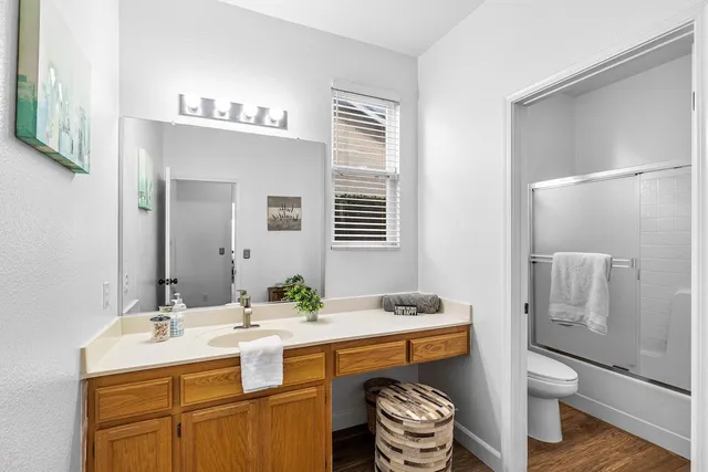 a view of a house with backyard sitting area and swimming pool