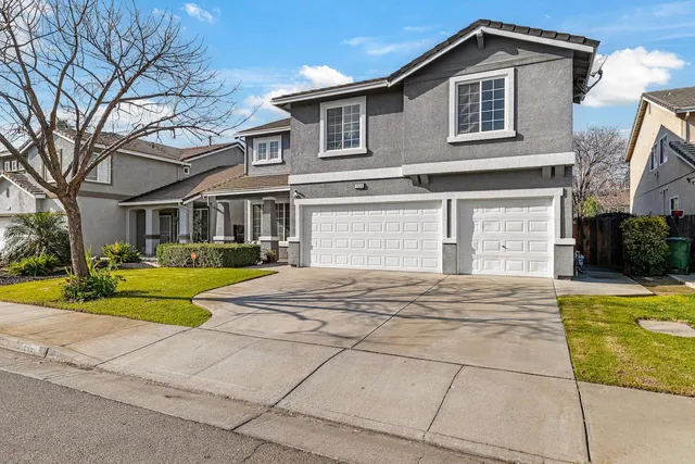 a front view of a house with a outdoor space