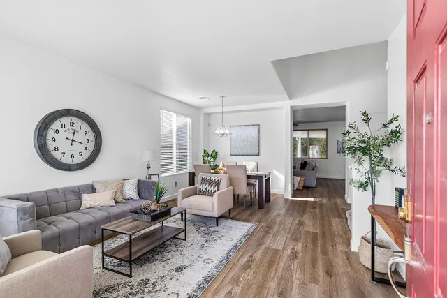 a view of a dining room with furniture window and wooden floor