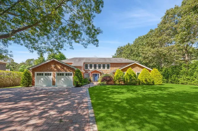 a front view of a house with yard