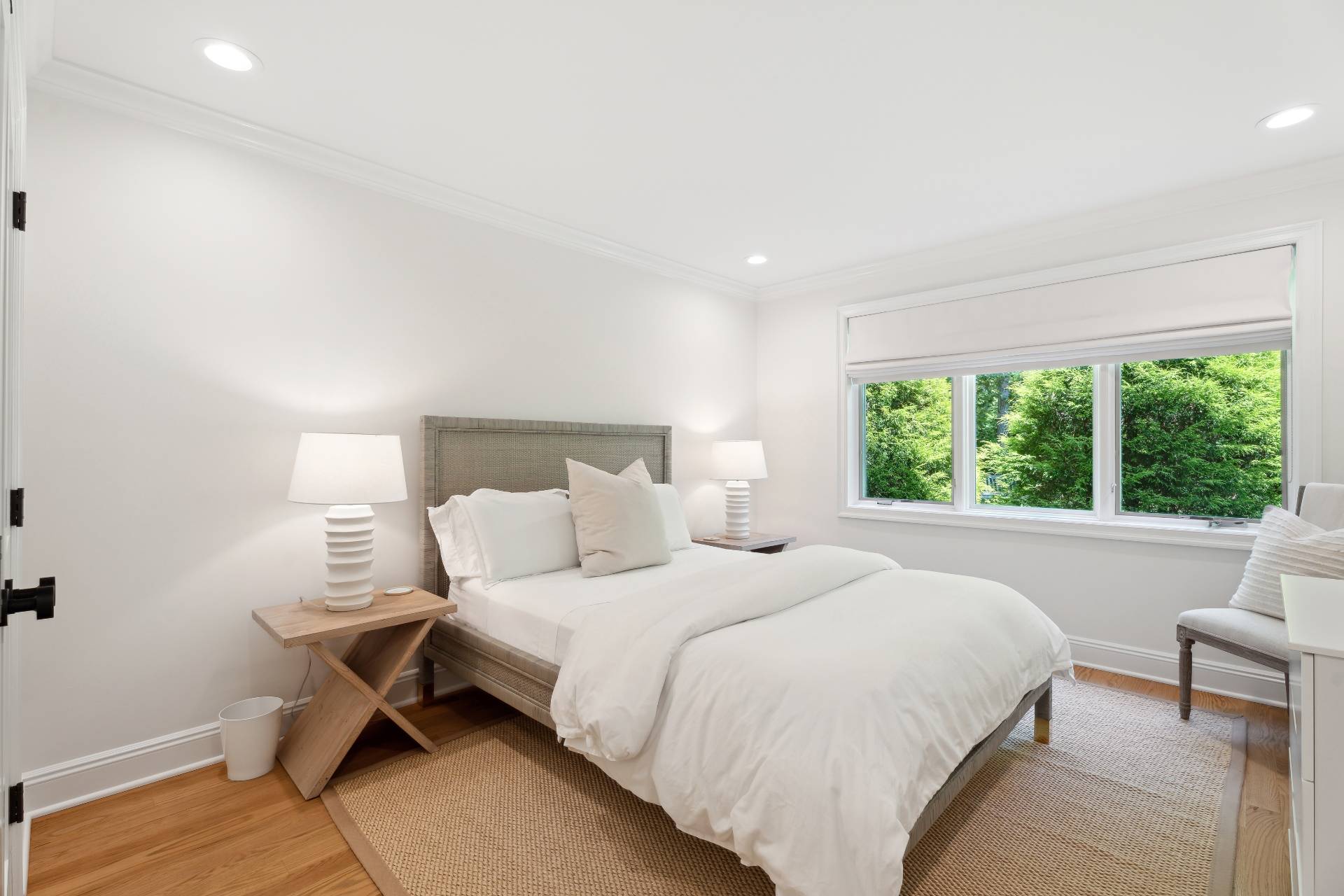 31 East Gate Road Wainscott, NY 11975 - Photo 11 of 20 a bedroom with a bed and a large window