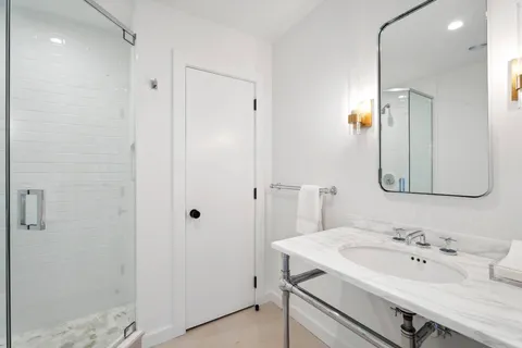 a bathroom with a sink and a mirror