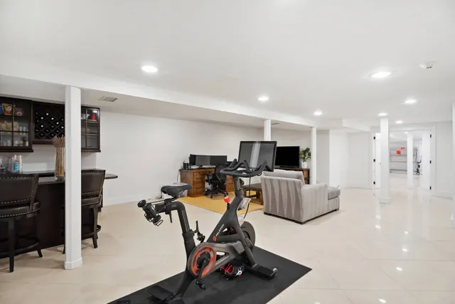 a patio view with a garden and outdoor seating