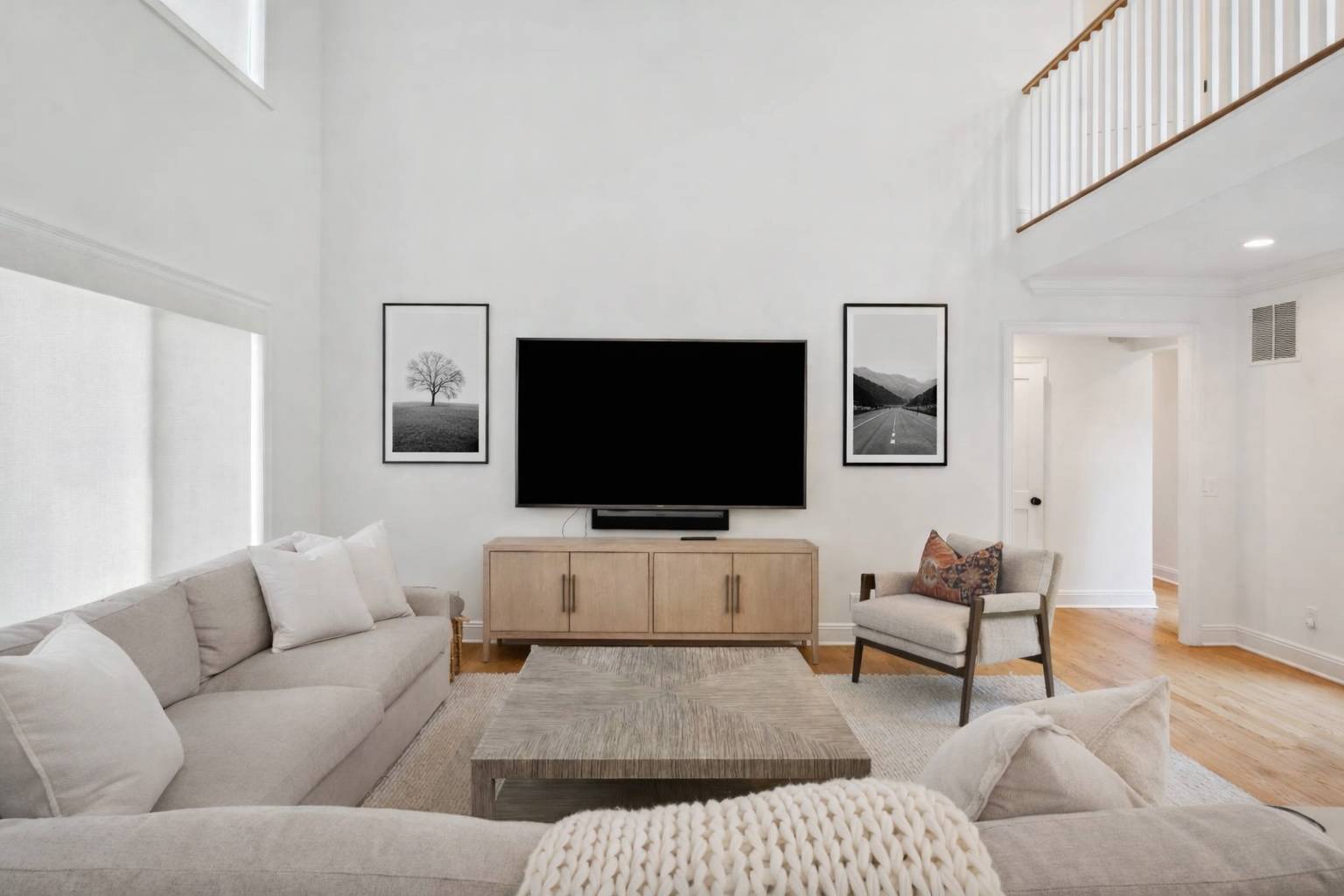 31 East Gate Road Wainscott, NY 11975 - Photo 4 of 20 a living room with furniture and a flat screen tv