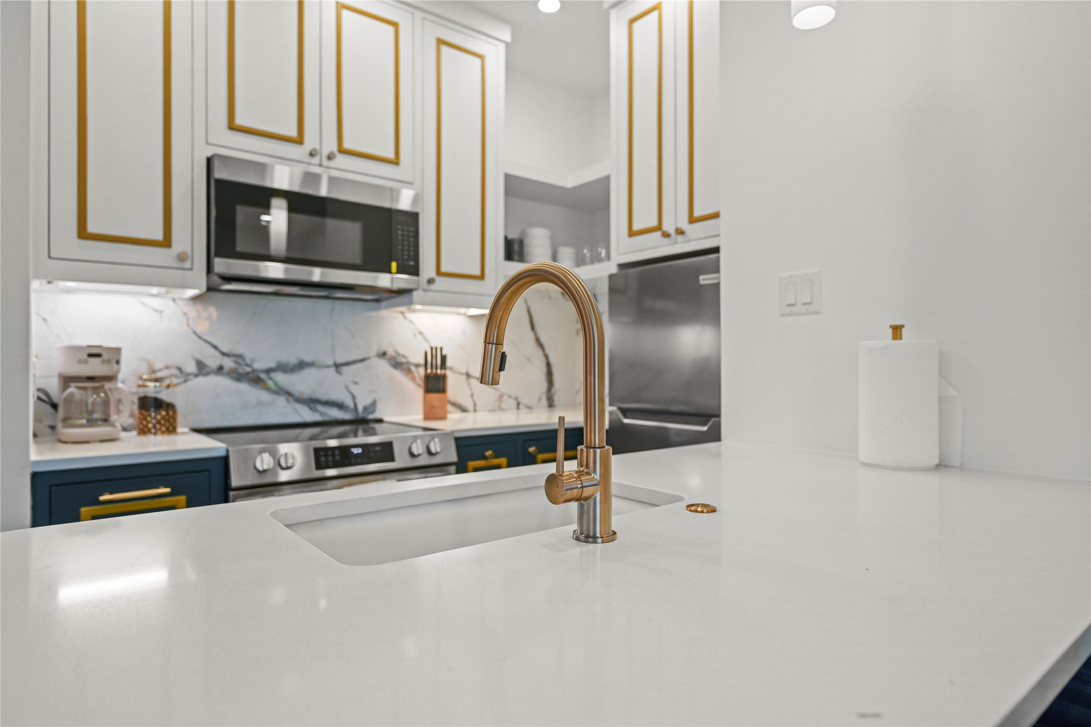 808 Sul Ross Street, Unit 6 Houston, TX 77006 - Photo 15 of 17 a kitchen with stainless steel appliances granite countertop a sink a stove and a microwave