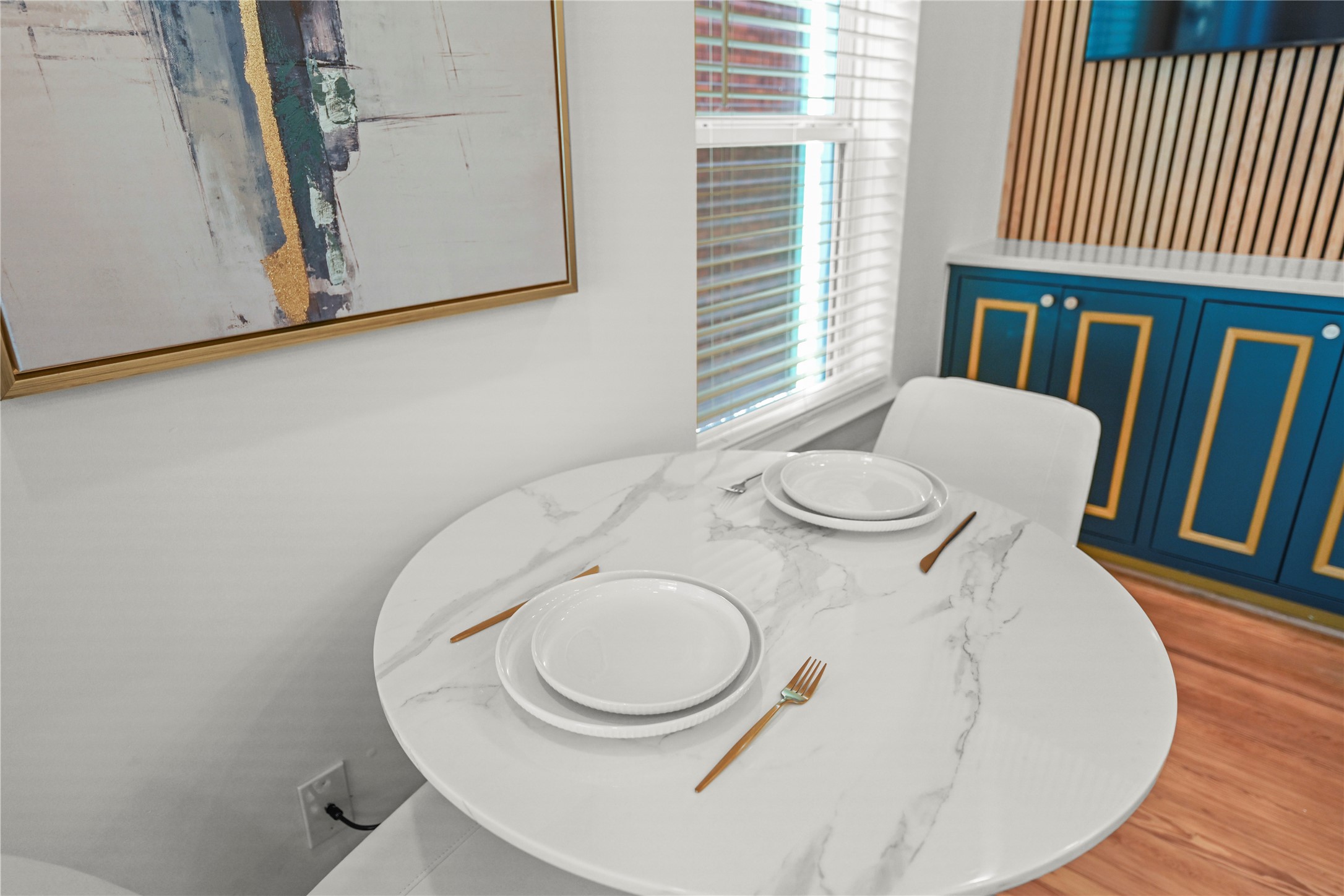 808 Sul Ross Street, Unit 6 Houston, TX 77006 - Photo 5 of 17 a close view of a dining table and chair with wooden floor