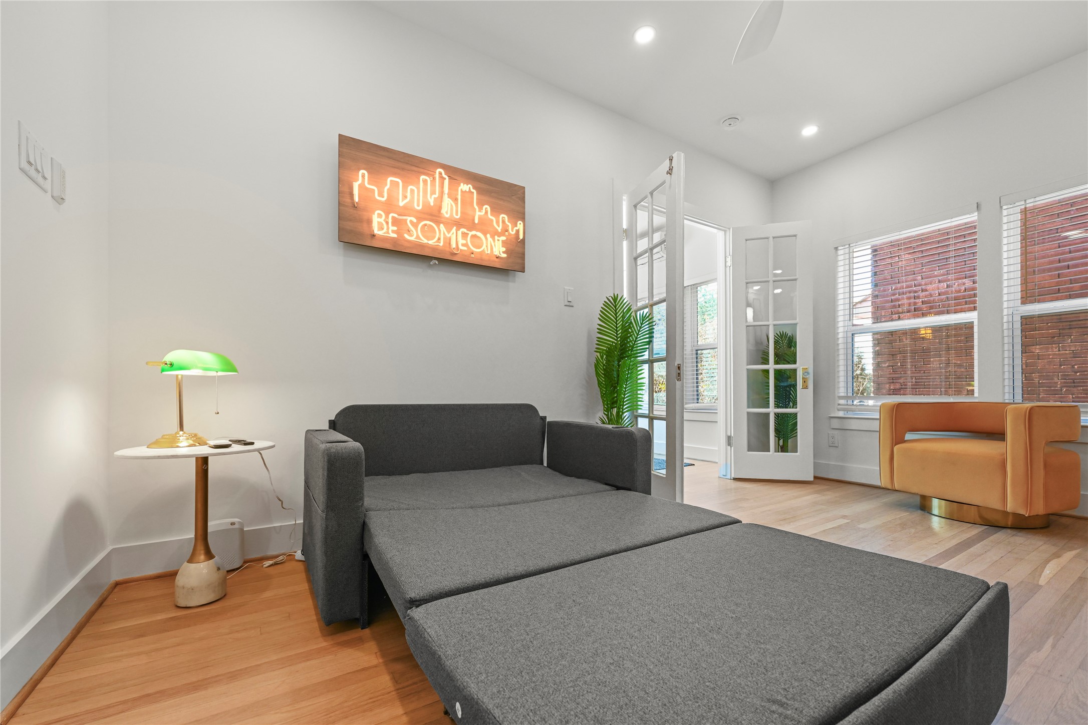 808 Sul Ross Street, Unit 6 Houston, TX 77006 - Photo 7 of 17 a living room with furniture and a floor to ceiling window