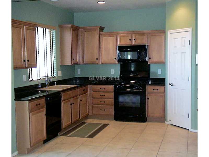 2460 Rue Bienville Way Henderson, NV 89044 - Photo 4 of 25 Property Photo. Upgraded Kitchen with Granite Counter tops, Tile floors and Recessed Lighting