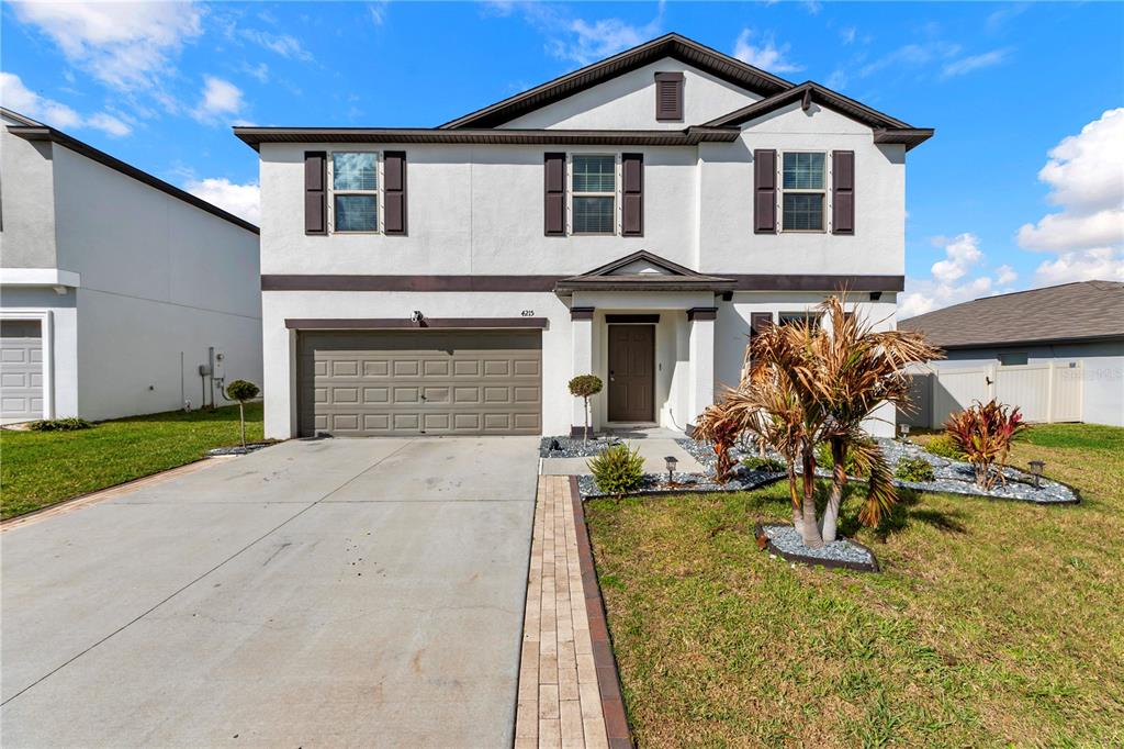 4215 Hanover Drive New Port Richey, FL 34653 - Photo 1 of 46 a front view of a house with garden