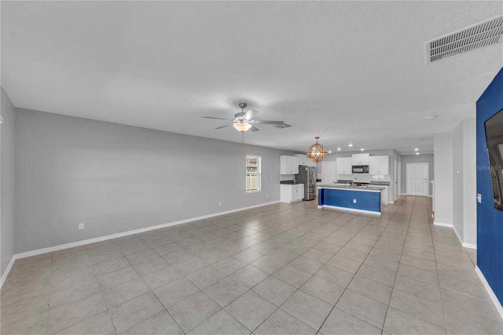 4215 Hanover Drive New Port Richey, FL 34653 - Photo 12 of 46 a view of an empty room with a kitchen