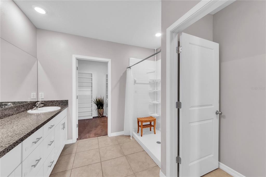 4215 Hanover Drive New Port Richey, FL 34653 - Photo 15 of 46 a bathroom with a granite countertop sink