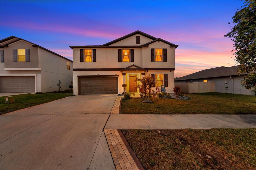 4215 Hanover Drive New Port Richey, FL 34653 - Photo 2 of 46 a front view of a house with a yard