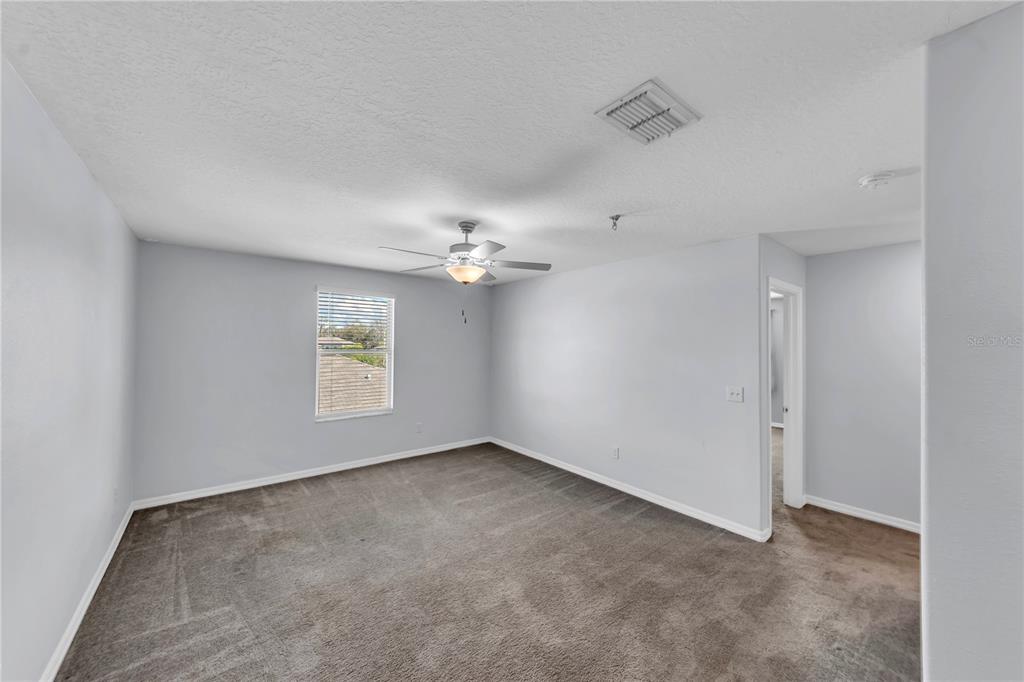4215 Hanover Drive New Port Richey, FL 34653 - Photo 23 of 46 wooden floor in an empty room with a window