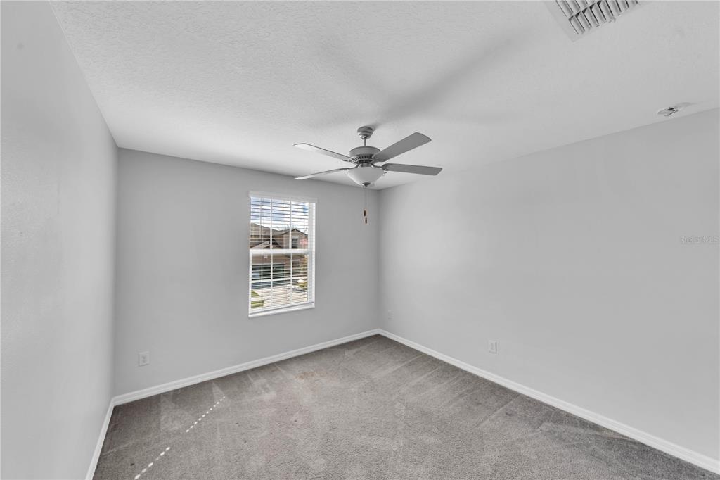 4215 Hanover Drive New Port Richey, FL 34653 - Photo 26 of 46 a view of a livingroom with a ceiling fan and window