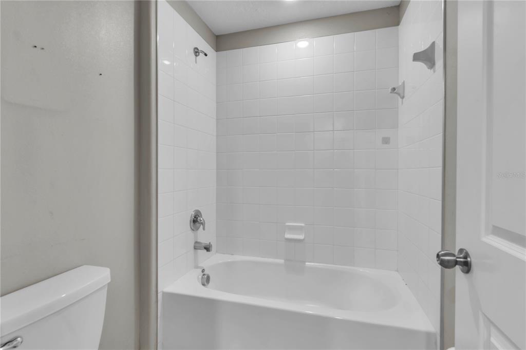4215 Hanover Drive New Port Richey, FL 34653 - Photo 29 of 46 a bathroom with a bathtub and a toilet