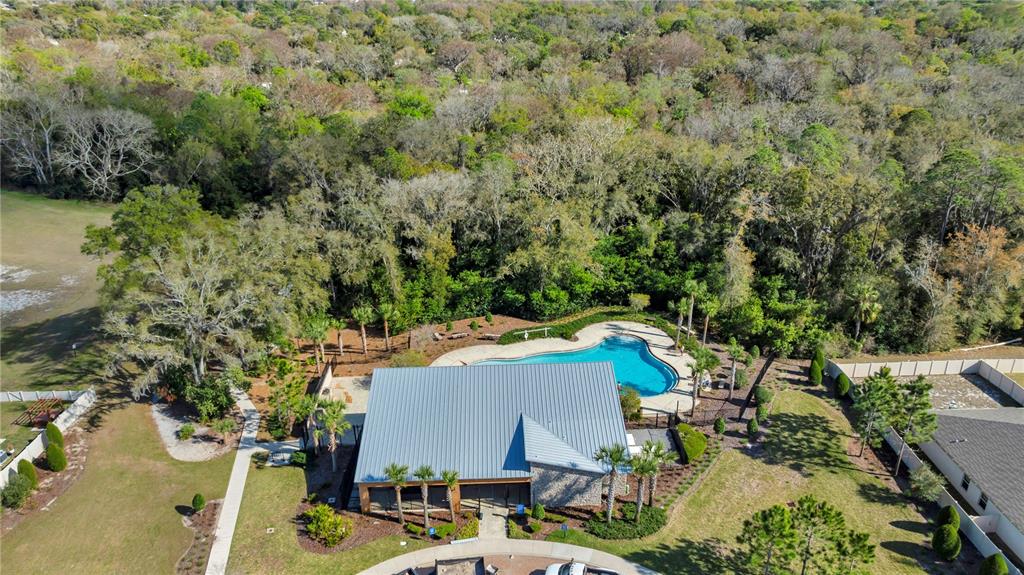 4215 Hanover Drive New Port Richey, FL 34653 - Photo 40 of 46 an aerial view of a house with yard swimming pool and outdoor seating