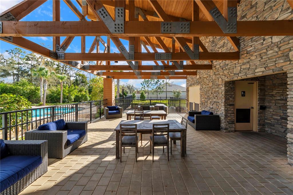 4215 Hanover Drive New Port Richey, FL 34653 - Photo 41 of 46 a view of a patio with a table and chairs