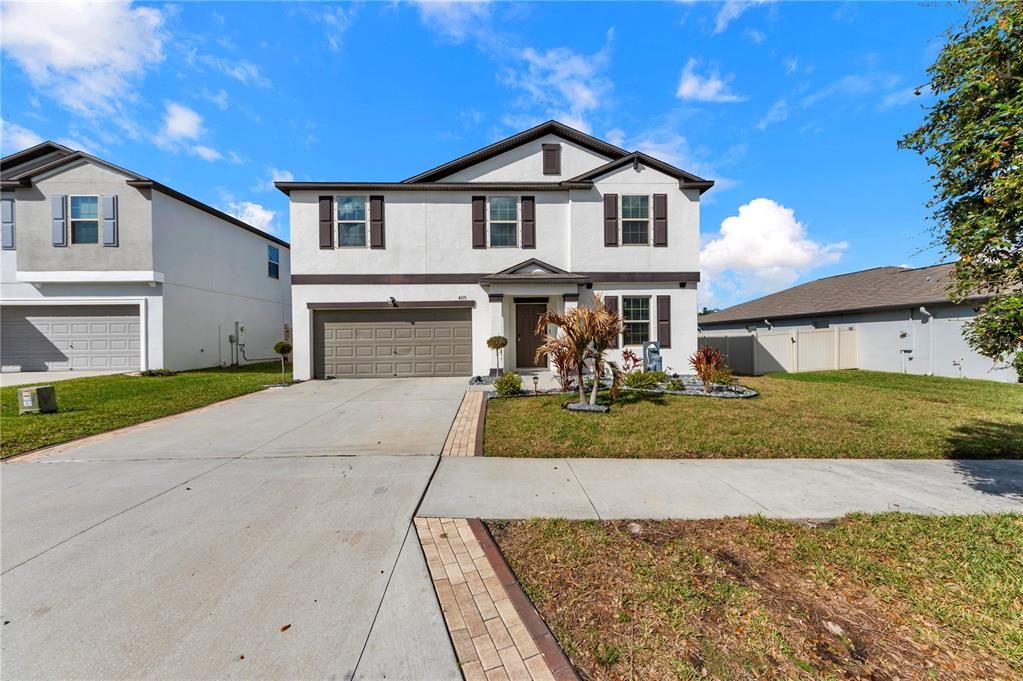 4215 Hanover Drive New Port Richey, FL 34653 - Photo 46 of 46 a front view of a house with a yard