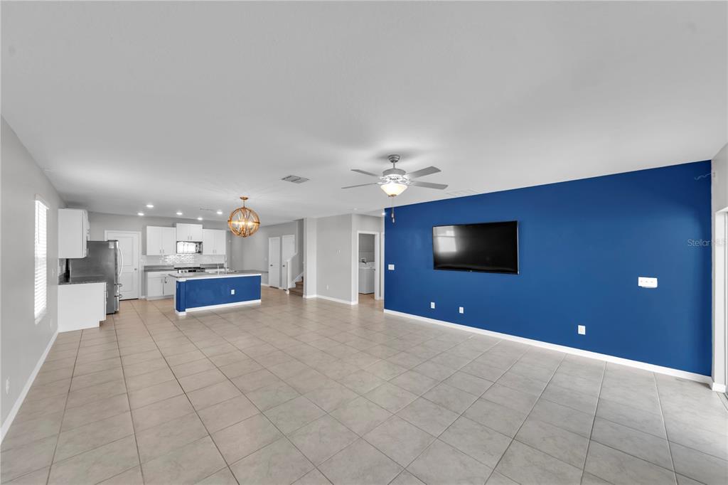 4215 Hanover Drive New Port Richey, FL 34653 - Photo 10 of 46 a view of a livingroom with furniture and a flat screen tv