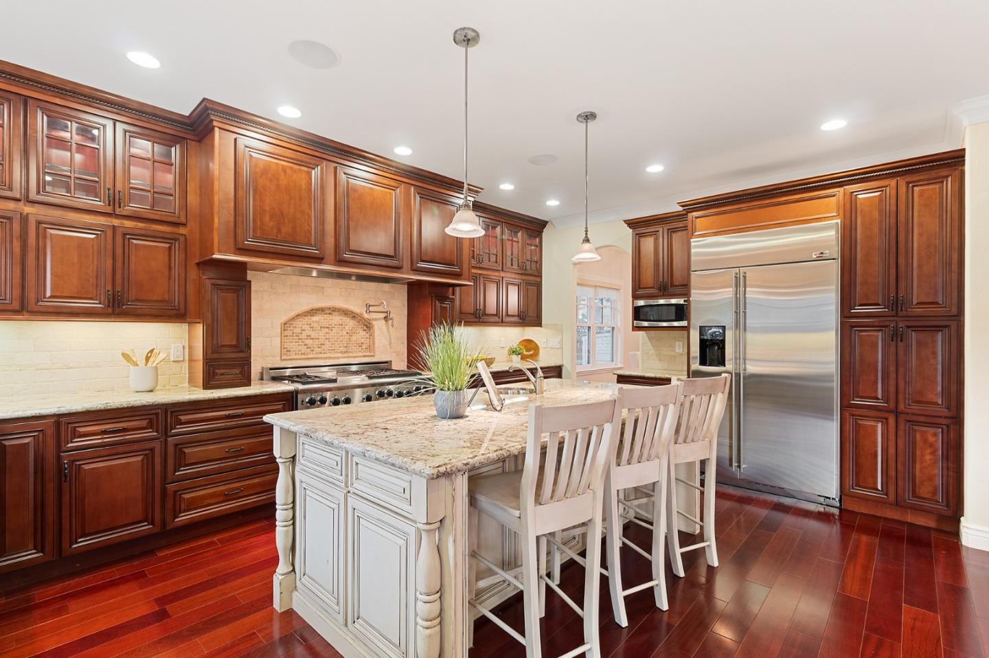 1665 Collingwood Avenue San Jose, CA 95125 - Photo 12 of 41 a kitchen with stainless steel appliances granite countertop a refrigerator a sink dishwasher a stove and white cabinets with wooden floor