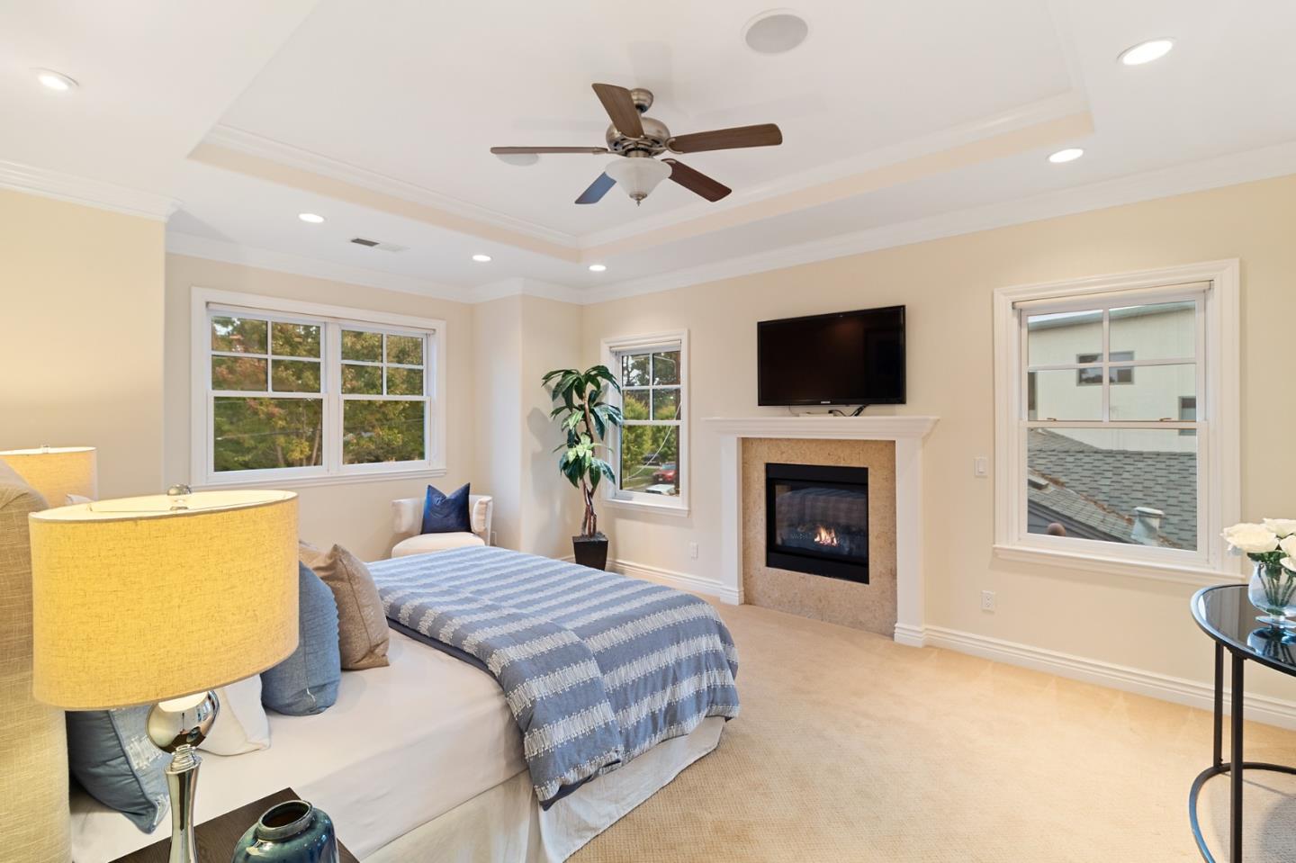 1665 Collingwood Avenue San Jose, CA 95125 - Photo 21 of 41 a living room with a fireplace furniture a flat screen tv and a large window