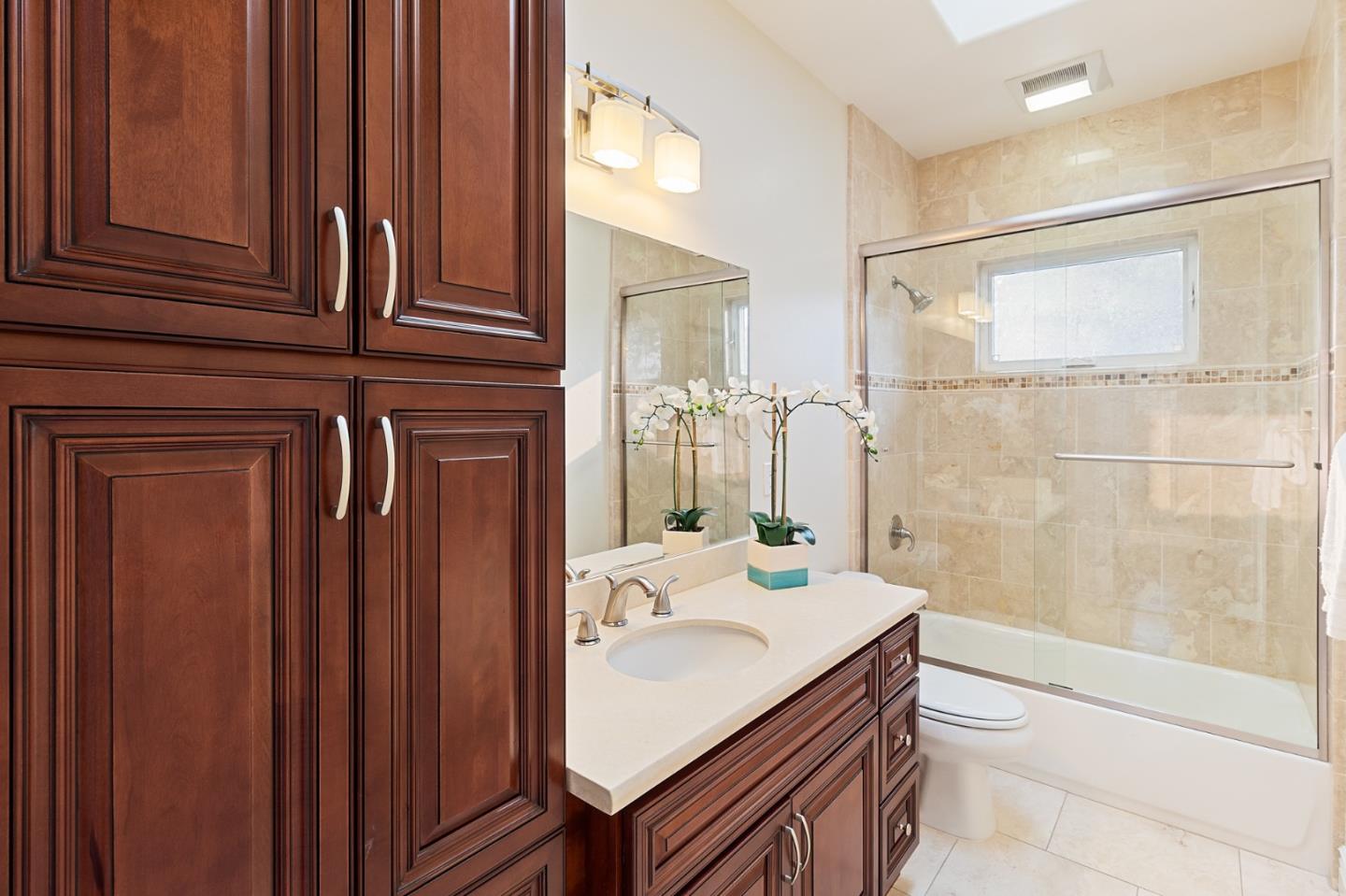 1665 Collingwood Avenue San Jose, CA 95125 - Photo 27 of 41 a bathroom with a sink a toilet and shower