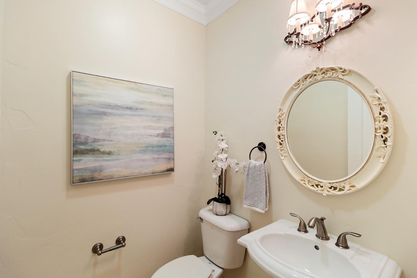 1665 Collingwood Avenue San Jose, CA 95125 - Photo 33 of 41 a bathroom with a toilet sink and mirror