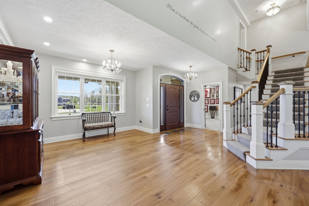 8 Fitch Farm Road Southampton, MA 01073 - Photo 12 of 42 a view of a livingroom with wooden floor and a fireplace