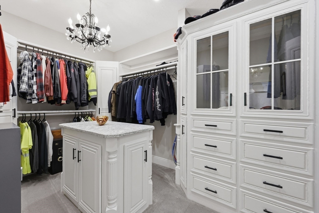 8 Fitch Farm Road Southampton, MA 01073 - Photo 17 of 42 a view of walk in closet with clothes and shoes