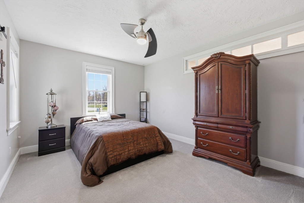 8 Fitch Farm Road Southampton, MA 01073 - Photo 23 of 42 a bedroom with a bed and a dresser