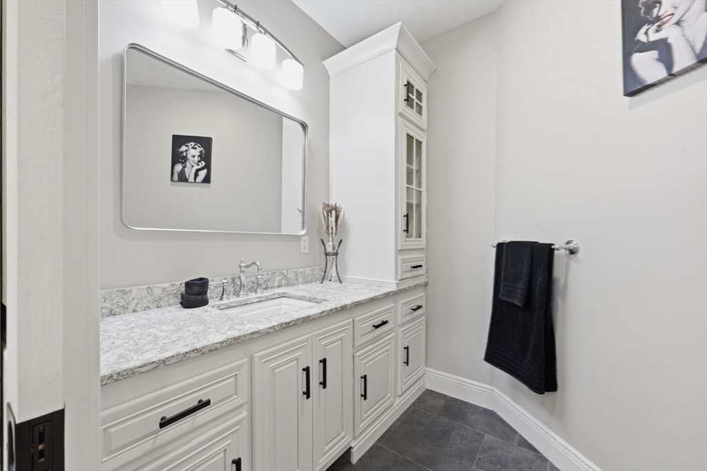 8 Fitch Farm Road Southampton, MA 01073 - Photo 25 of 42 a bathroom with a double vanity sink and mirror