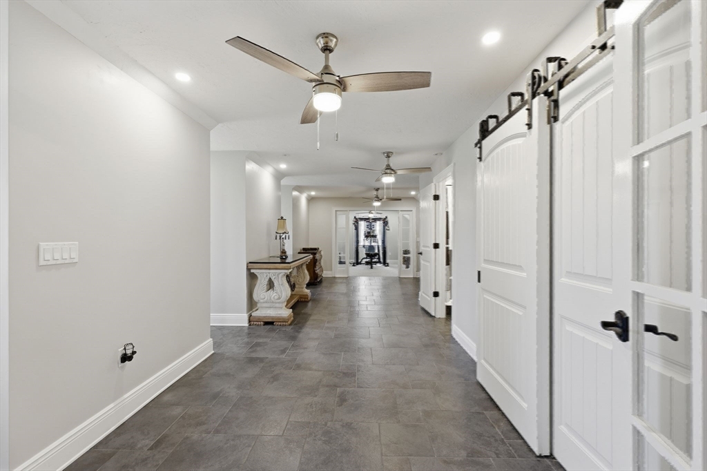 8 Fitch Farm Road Southampton, MA 01073 - Photo 27 of 42 a view of a hallway with toilet and a chandelier
