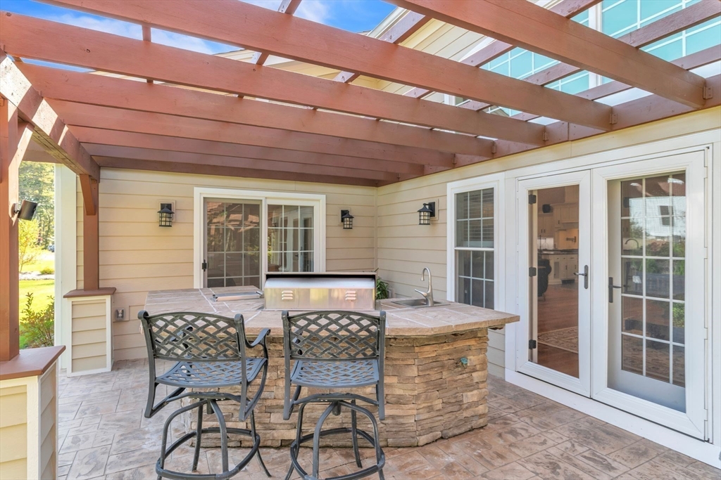 8 Fitch Farm Road Southampton, MA 01073 - Photo 33 of 42 a view of a patio with table and chairs and potted plants