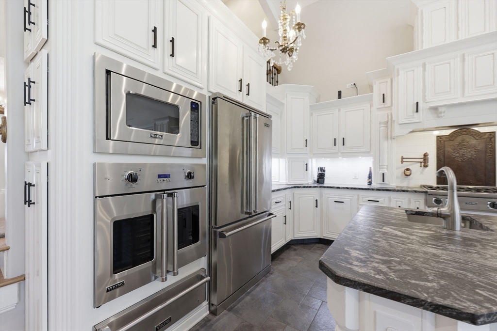 8 Fitch Farm Road Southampton, MA 01073 - Photo 9 of 42 a kitchen with stainless steel appliances granite countertop a stove microwave and cabinets