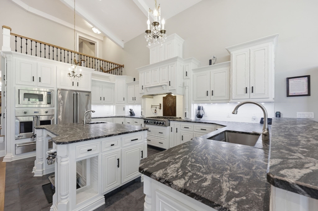8 Fitch Farm Road Southampton, MA 01073 - Photo 10 of 42 a kitchen with stainless steel appliances granite countertop a sink and cabinets