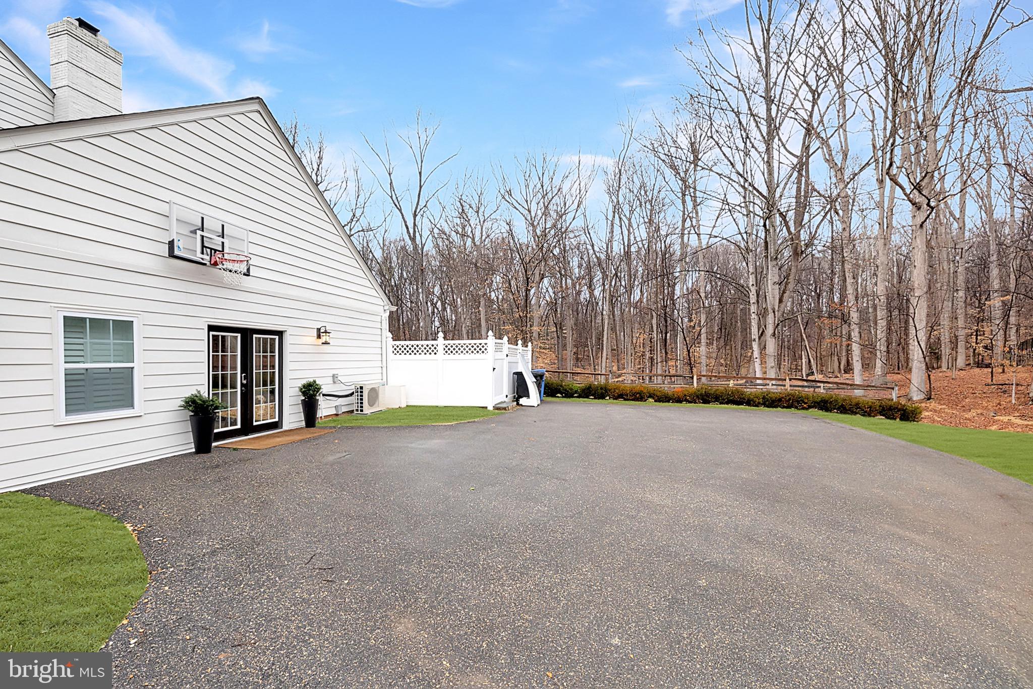 8701 Belmart Road Potomac, MD 20854 - Photo 37 of 39 Driveway with Access to the Fitness Room/Mudroom