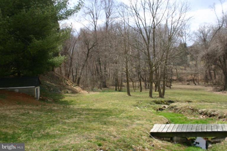 55 Walnut Grove Road Elkton, MD 21921 - Photo 7 of 10 BACK YARD SLOPES TO CREEK