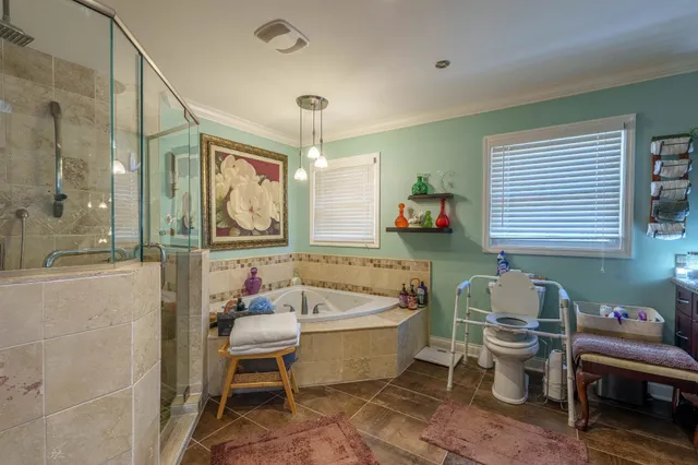 a spacious bathroom with a sink mirror and a bath tub