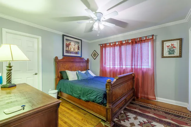 a bedroom with a bed and a dresser