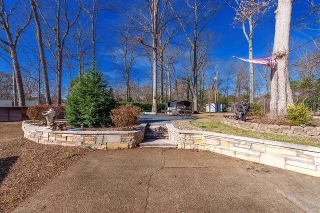 a view of a house with outdoor space and sitting area