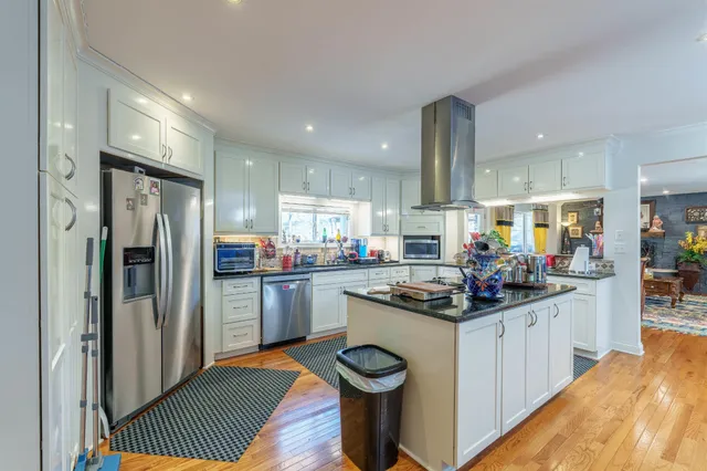 a kitchen with a sink stove and refrigerator