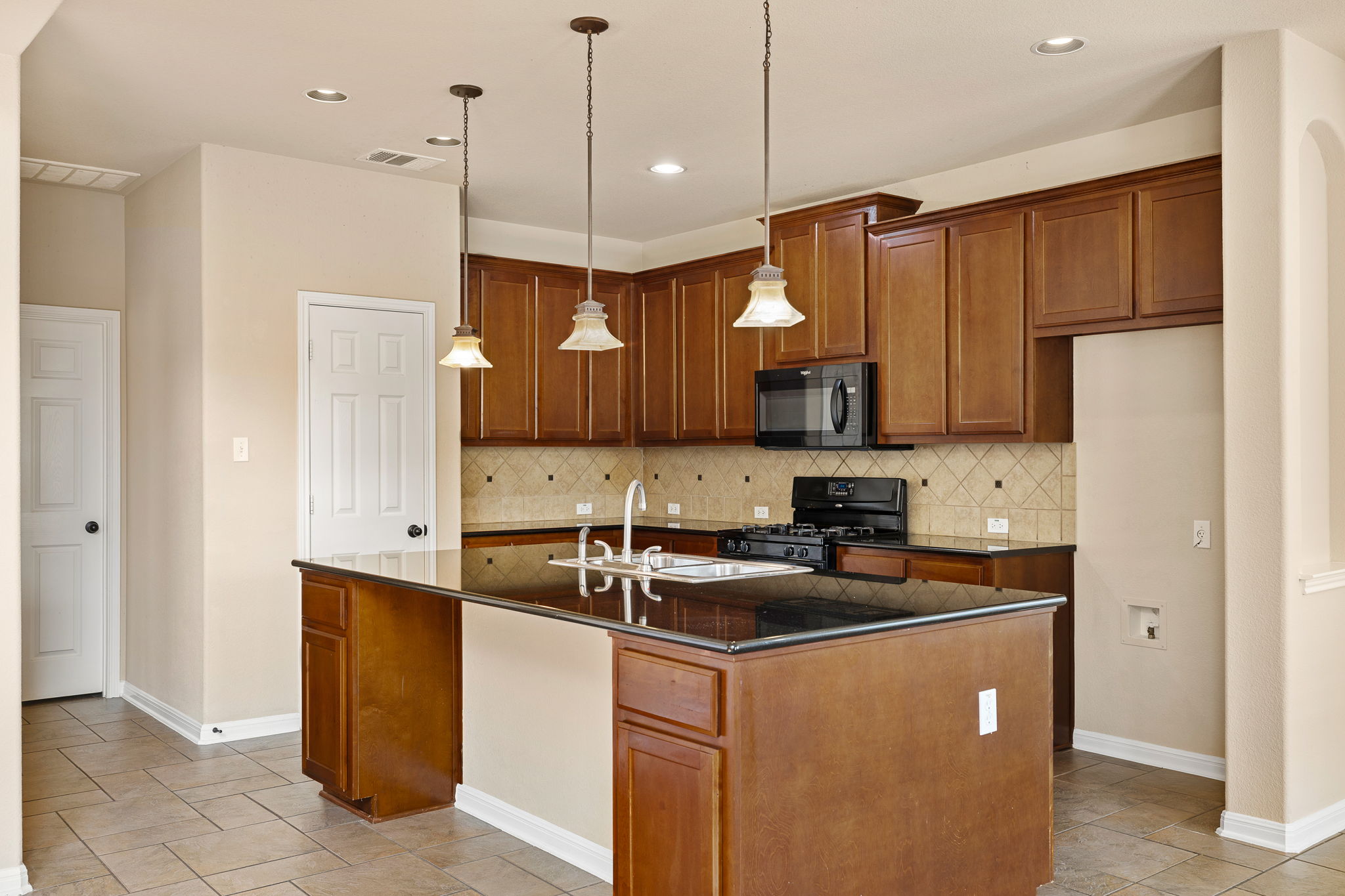 676 Rusk Road Round Rock, TX 78665 - Photo 11 of 35 Kitchen with plenty of storage and counter space