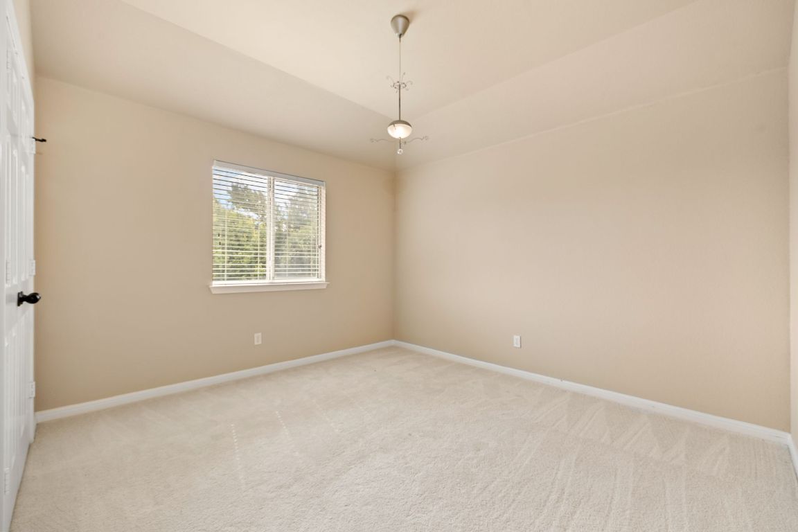 676 Rusk Road Round Rock, TX 78665 - Photo 25 of 35 Secondary bedroom 3